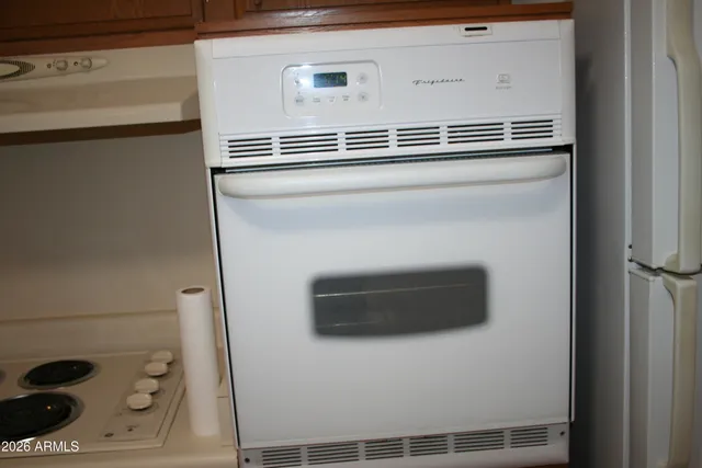 a view of storage and utility room with washer and dryer