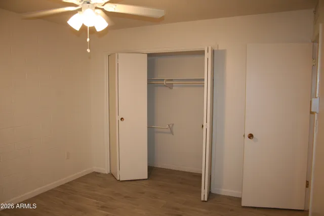 a view of a small space with wooden floor