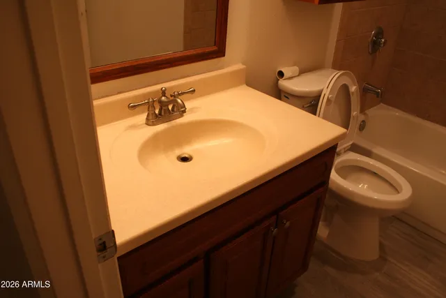 a bathroom with a shower and a mirror