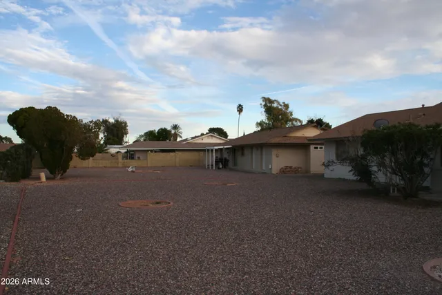 a view of a house with a street