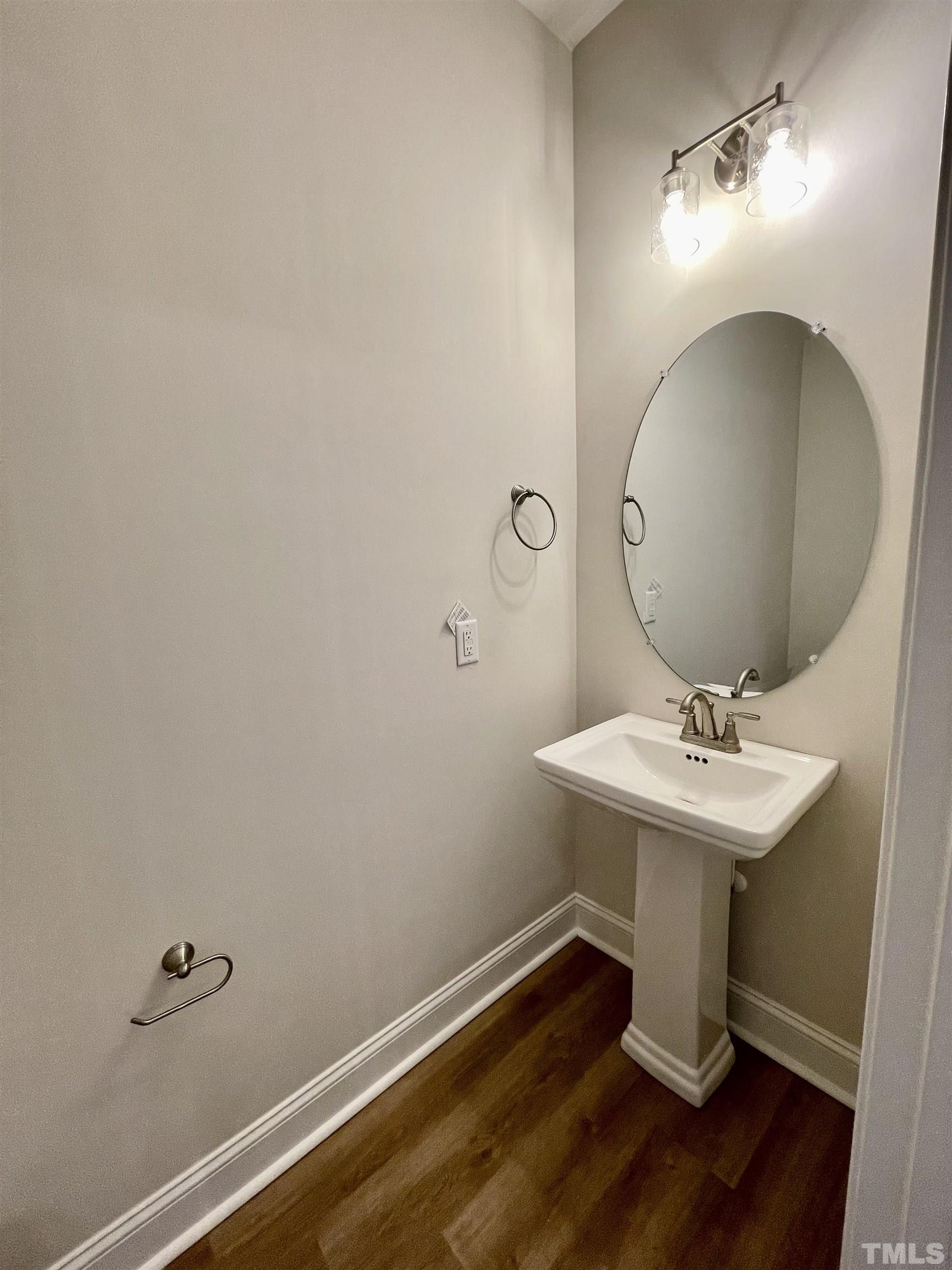 35 Mulberry Road Spring Hope, NC 27882 - Photo 12 of 32 a bathroom with a sink a mirror and vanity