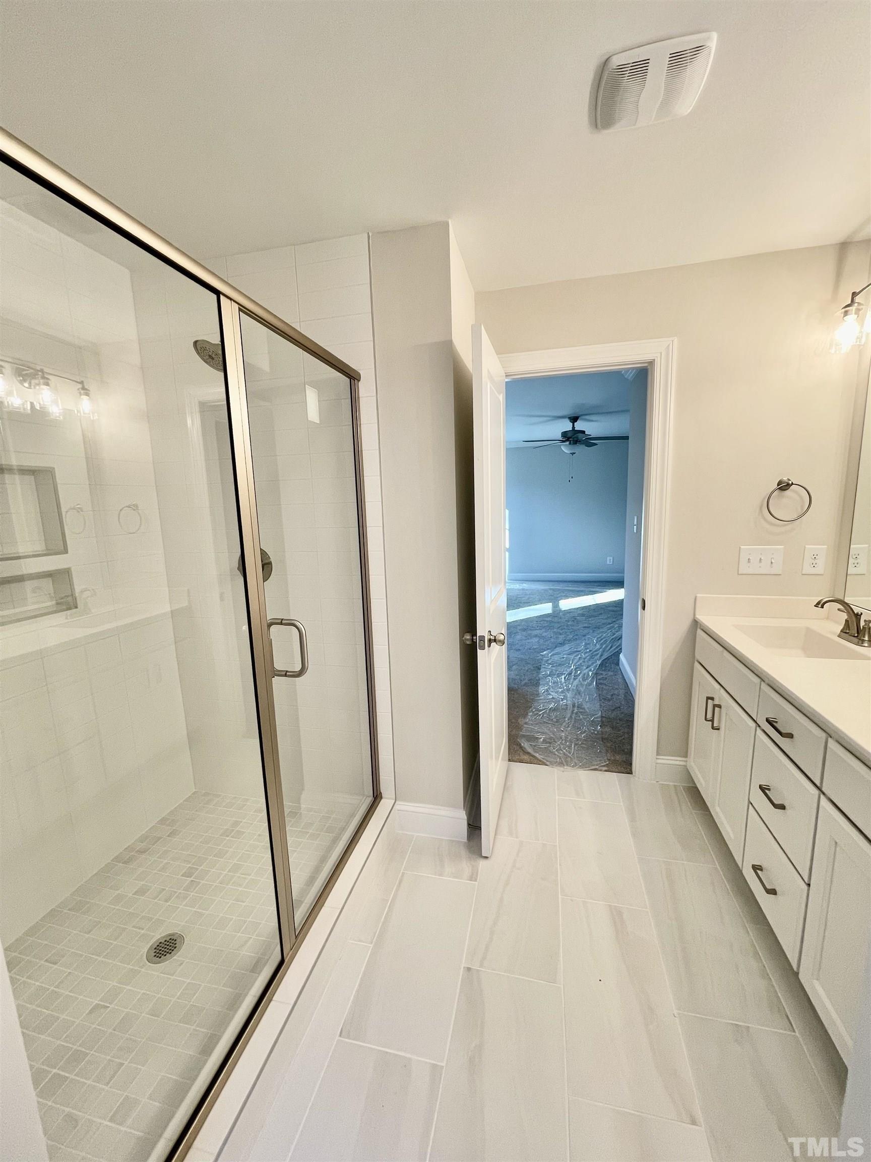 35 Mulberry Road Spring Hope, NC 27882 - Photo 21 of 32 a bathroom with a shower and a sink