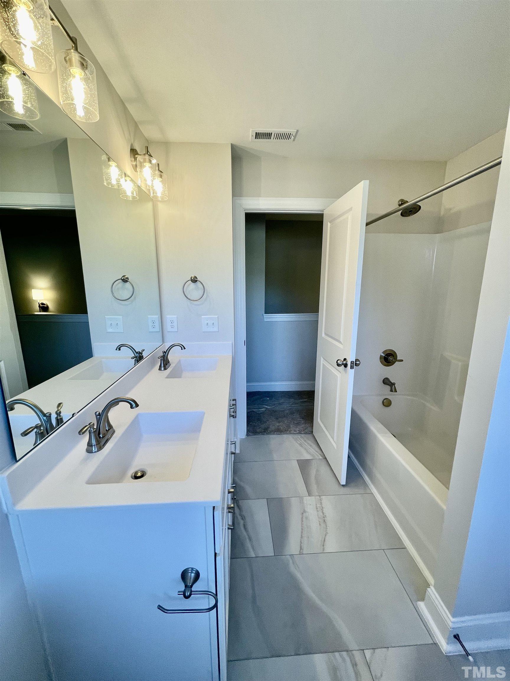 35 Mulberry Road Spring Hope, NC 27882 - Photo 28 of 32 a bathroom with a sink a toilet and shower