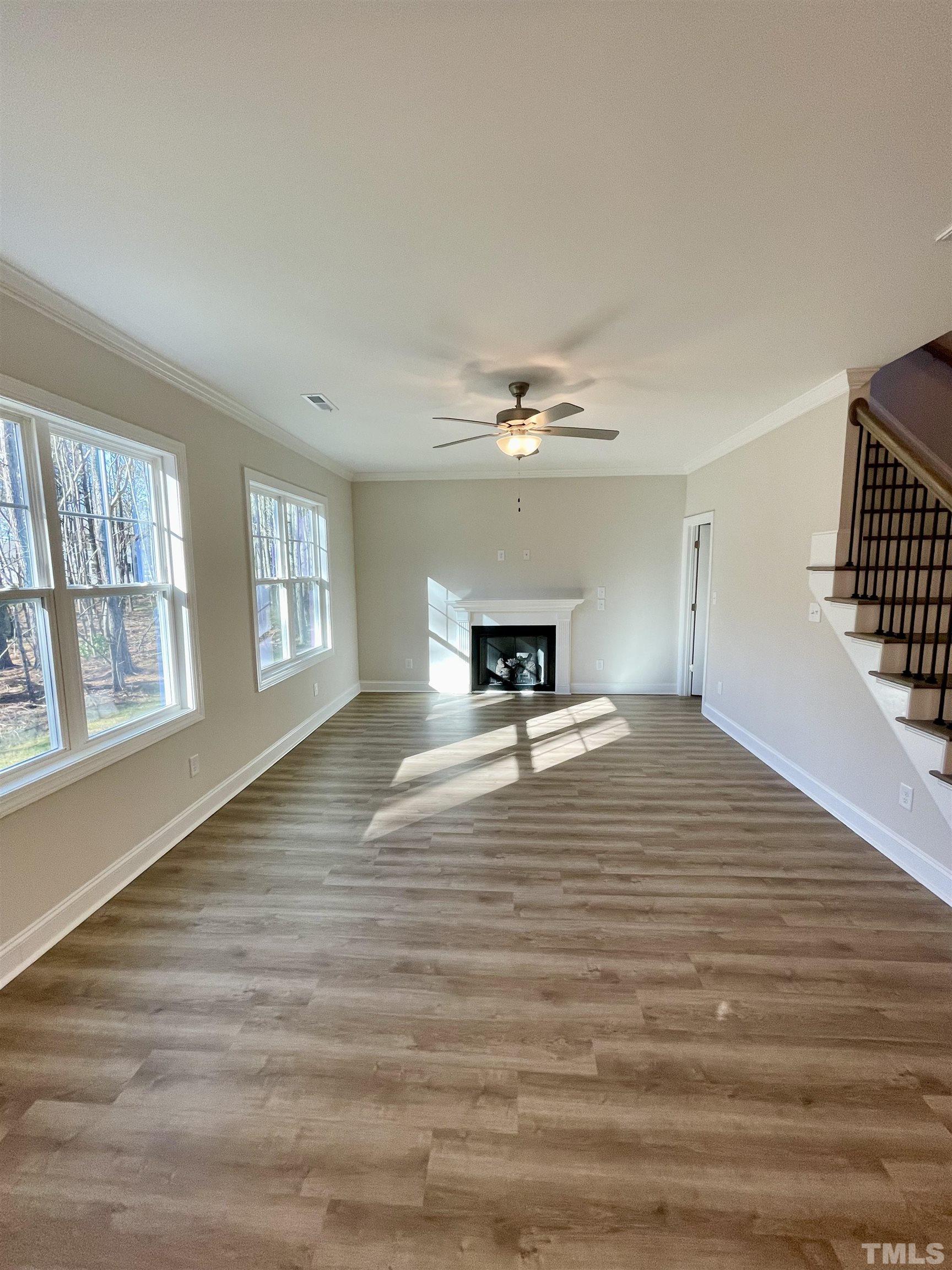 35 Mulberry Road Spring Hope, NC 27882 - Photo 10 of 32 a view of empty room with wooden floor and fan