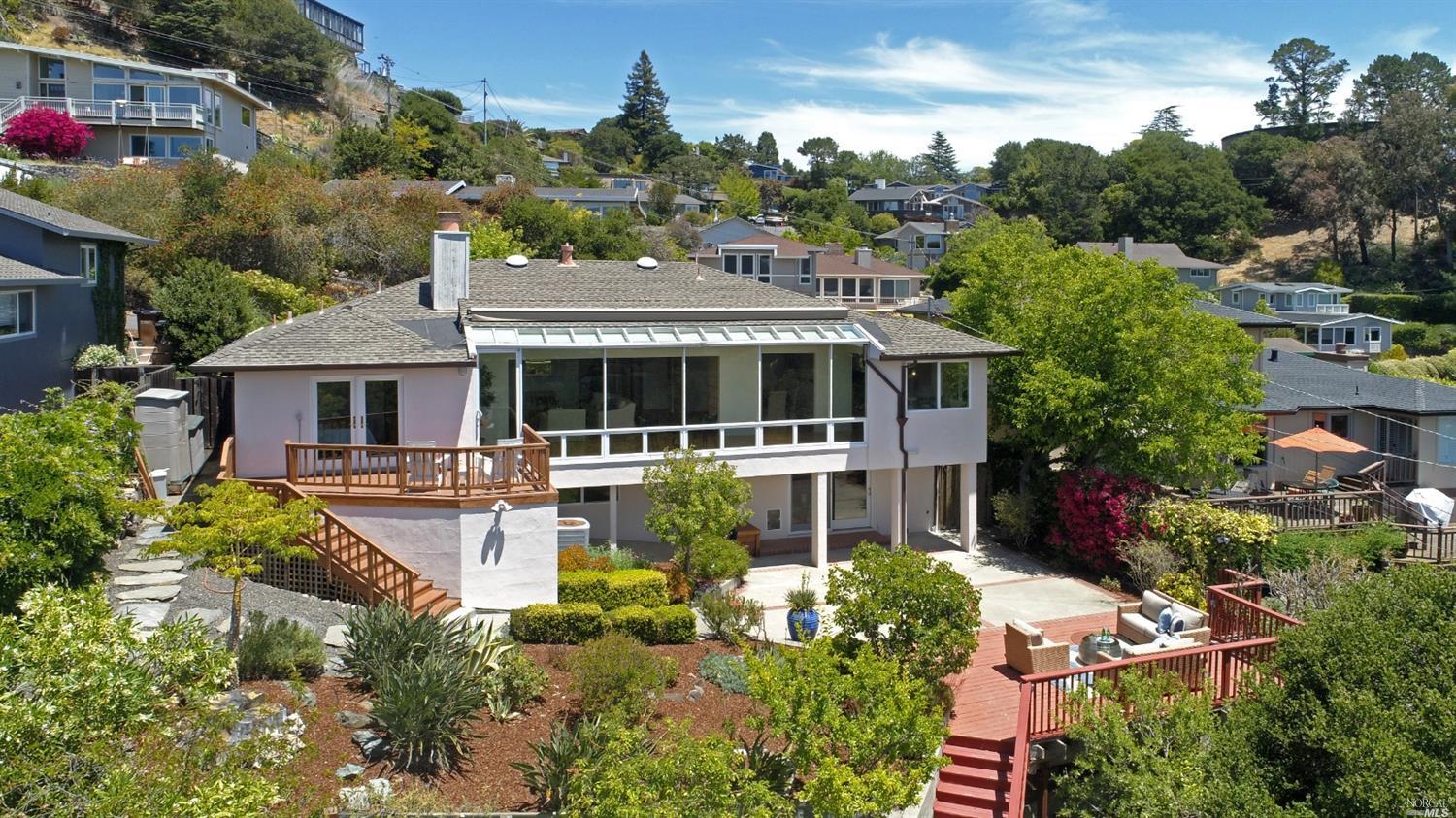an aerial view of house with yard swimming pool and outdoor seating