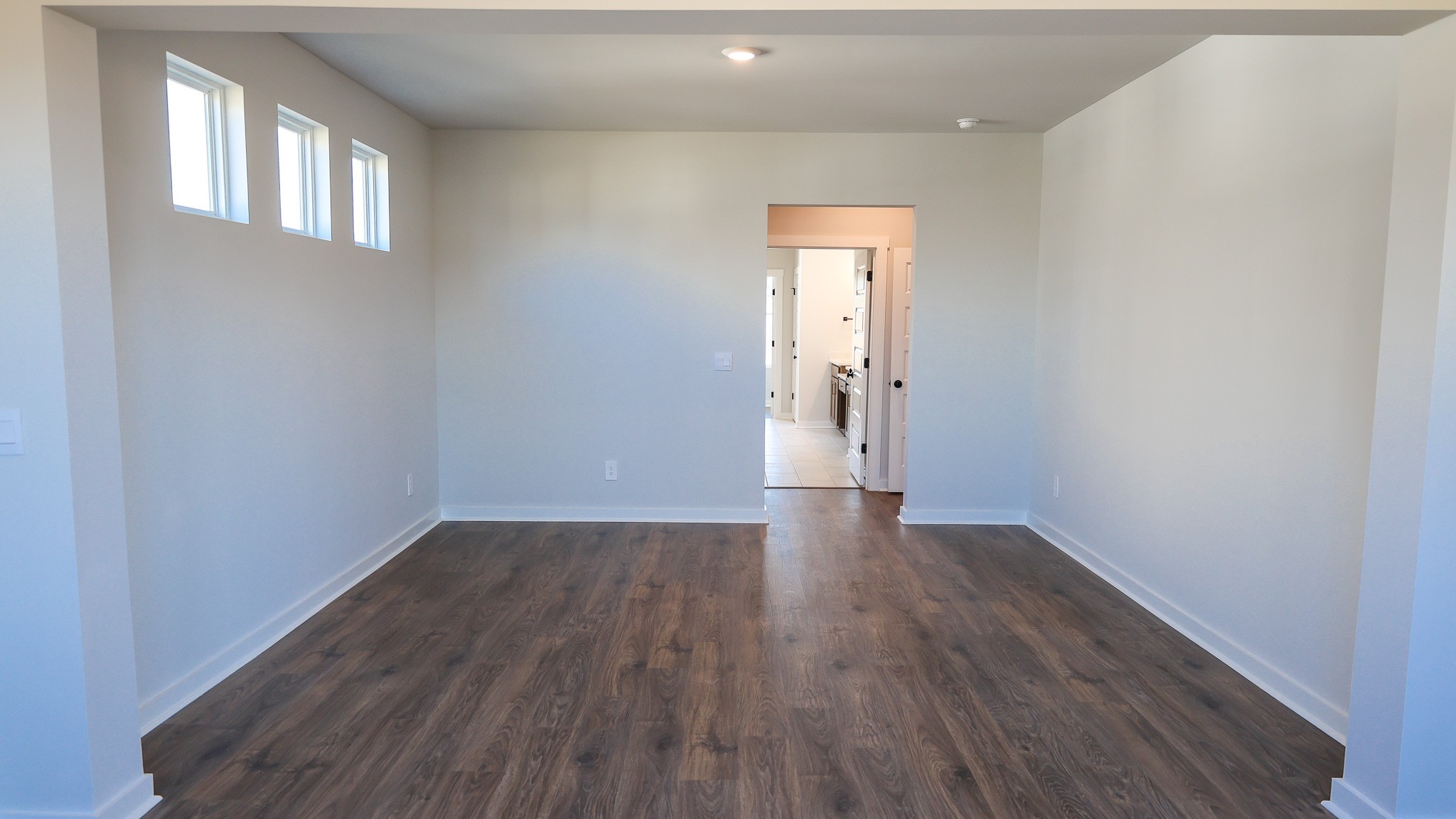308 Harvest Point Boulevard Spring Hill, TN 37174 - Photo 29 of 91 a view of an empty room with wooden floor and a window