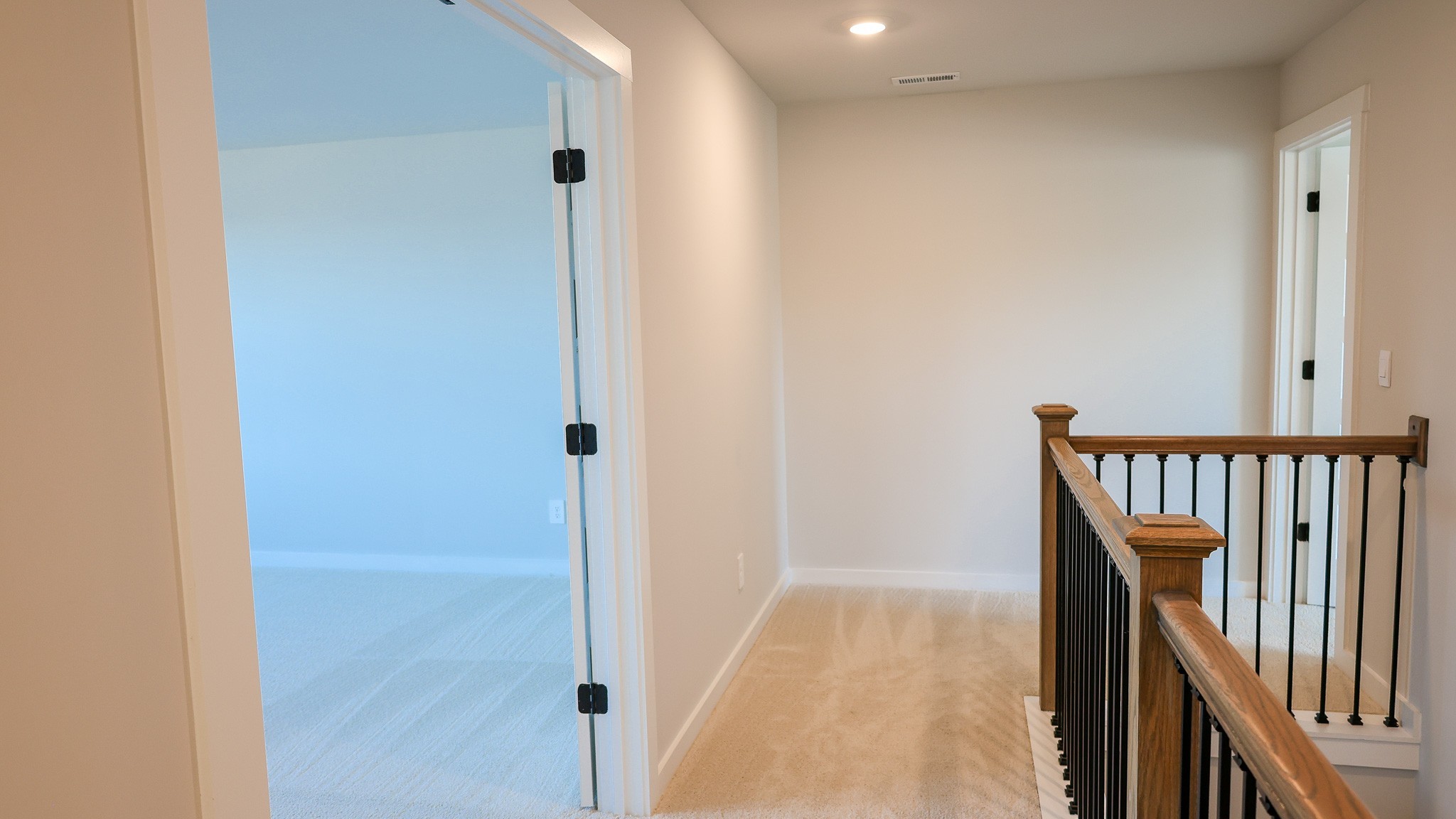 308 Harvest Point Boulevard Spring Hill, TN 37174 - Photo 47 of 91 a view of a hallway with wooden floor