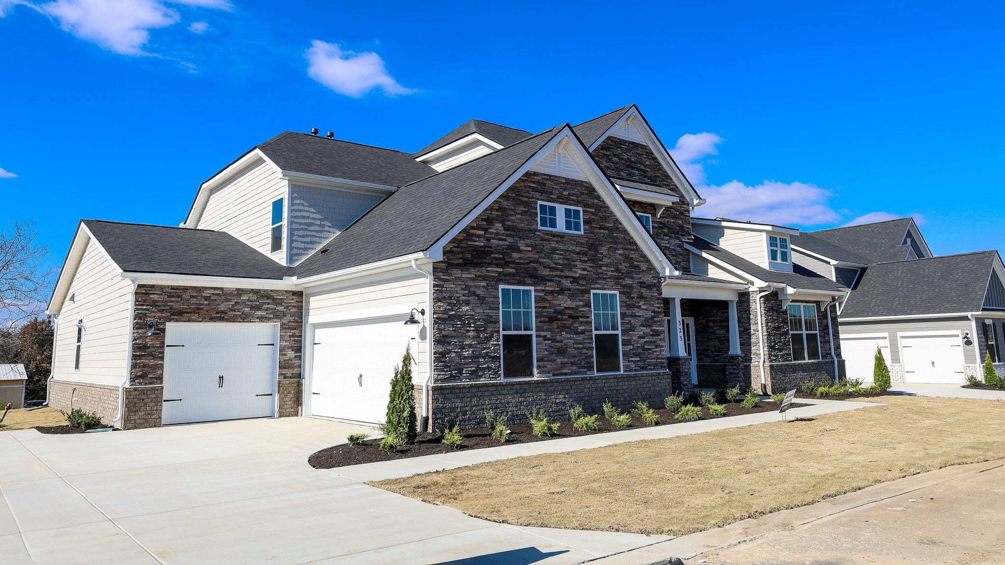 308 Harvest Point Boulevard Spring Hill, TN 37174 - Photo 6 of 91 a front view of a house with a yard