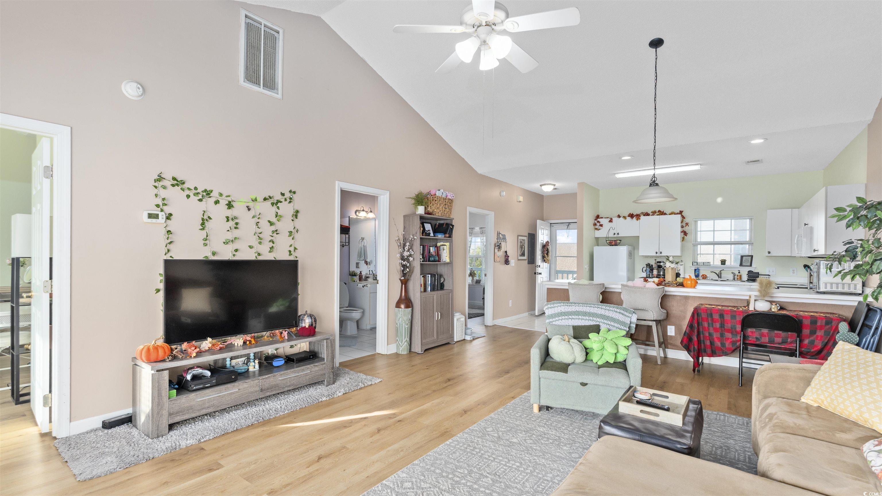 3931 Gladiola Court, Unit 303 Myrtle Beach, SC 29588 - Photo 6 of 26 Living area with high vaulted ceiling, light wood-style flooring, and ceiling fan
