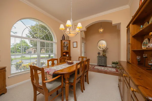 a view of a kitchen island a sink and living room with a sink
