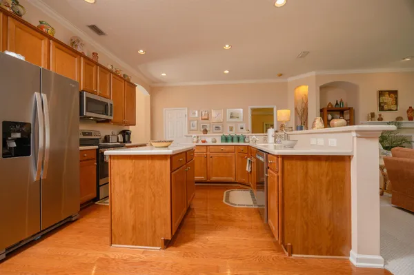 a living room with furniture fireplace and a large window