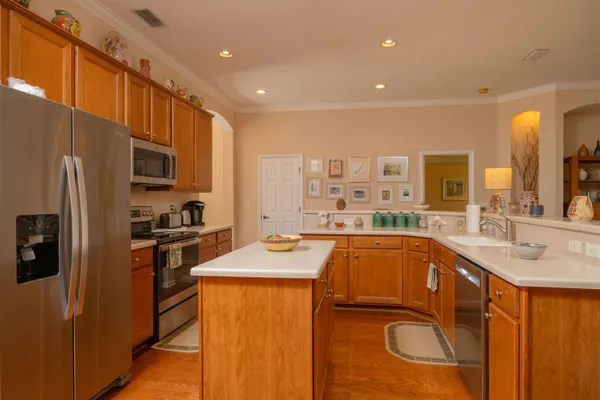 a living room with furniture a fireplace and a large window