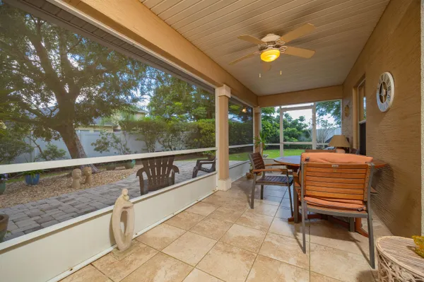a spacious bedroom with a large bed and a chandelier
