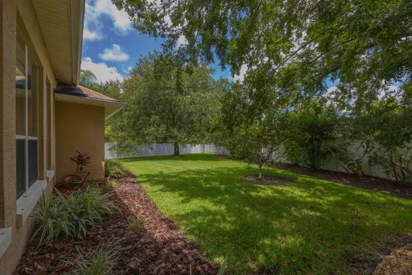 a bathroom with a granite countertop sink a toilet and a shower