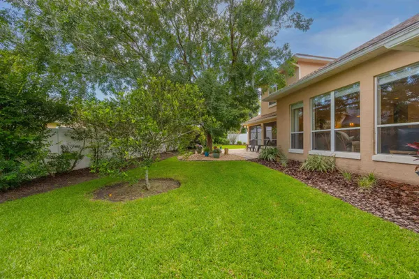 a spacious bedroom with two beds and painted walls