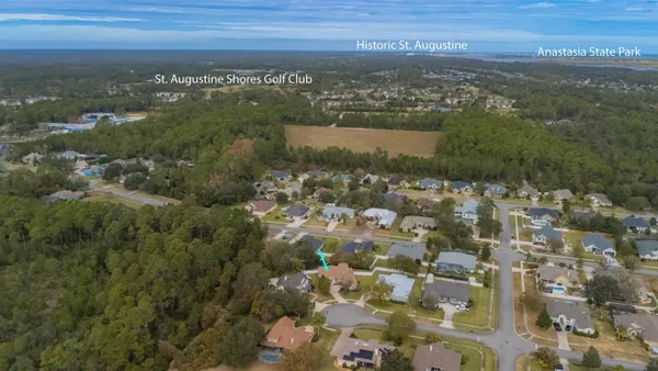 a front view of a house with a garden and yard
