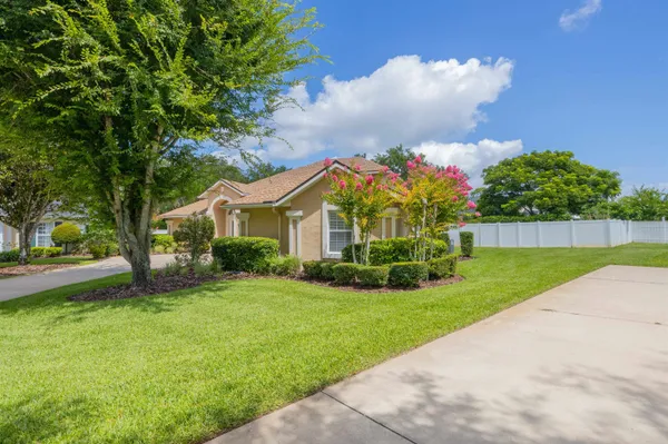 a front view of a house with garden