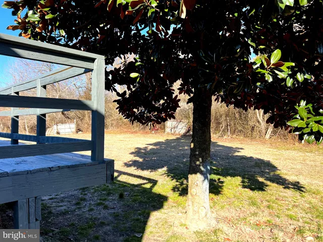 a bathroom with a tub shower and vanity
