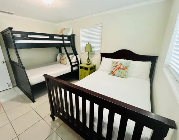 a bedroom with furniture and a window