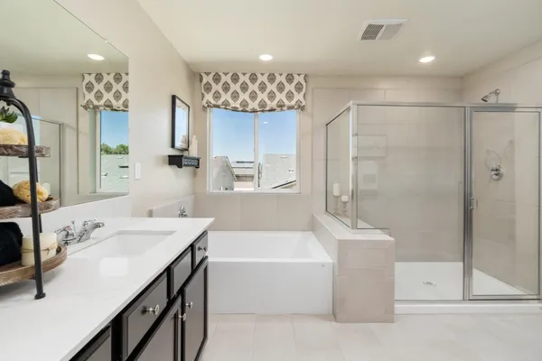 a view of walk in closet with clothes