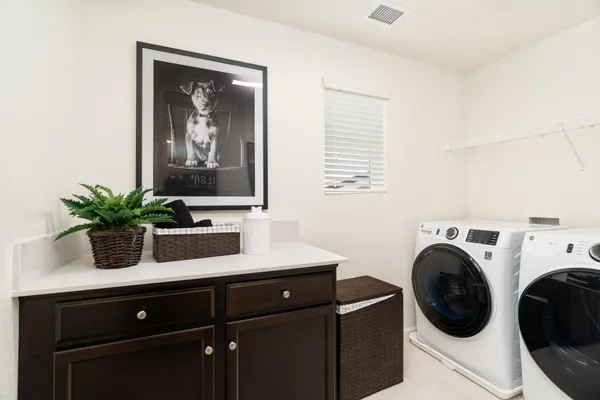 a bathroom with a sink a large mirror and a shower