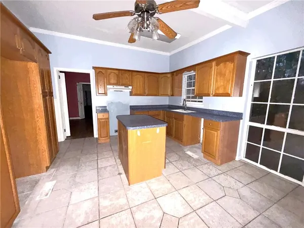 a view of kitchen with furniture and window