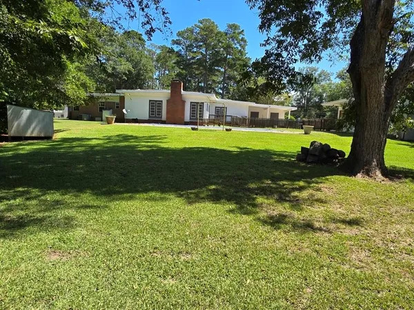 a view of a house with a big yard