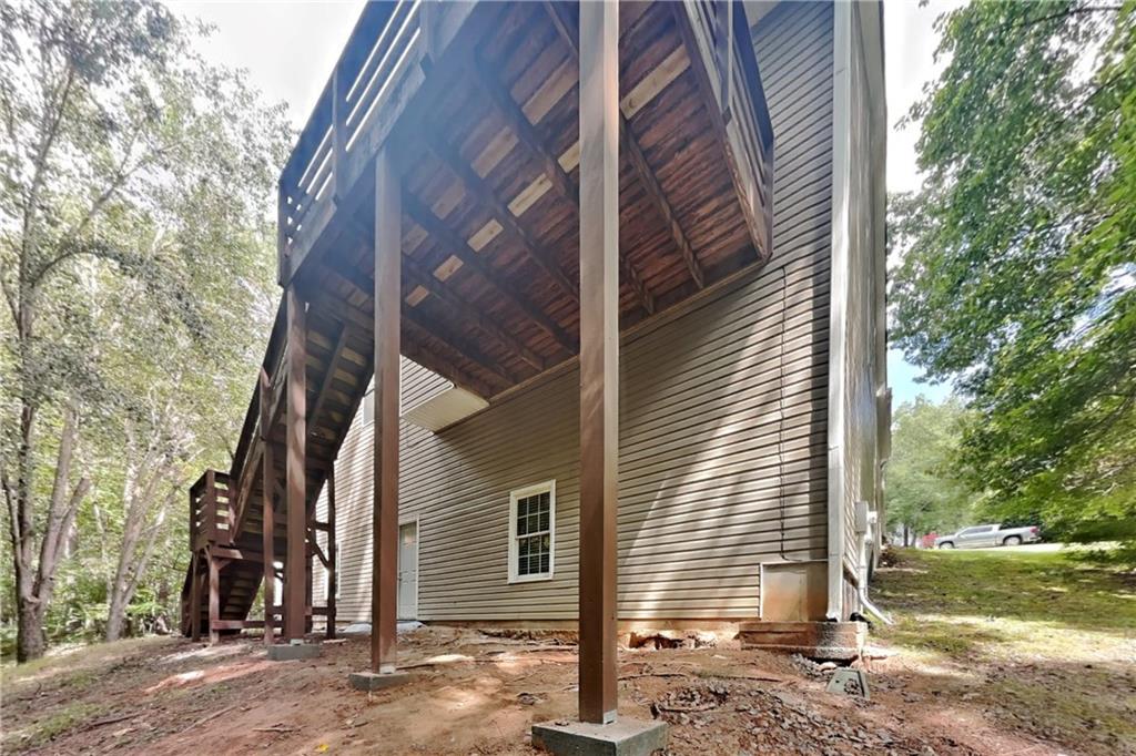 3013 Rockview Drive Loganville, GA 30052 - Photo 18 of 19 a view of a house with a yard