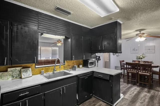 a kitchen with a sink and stove