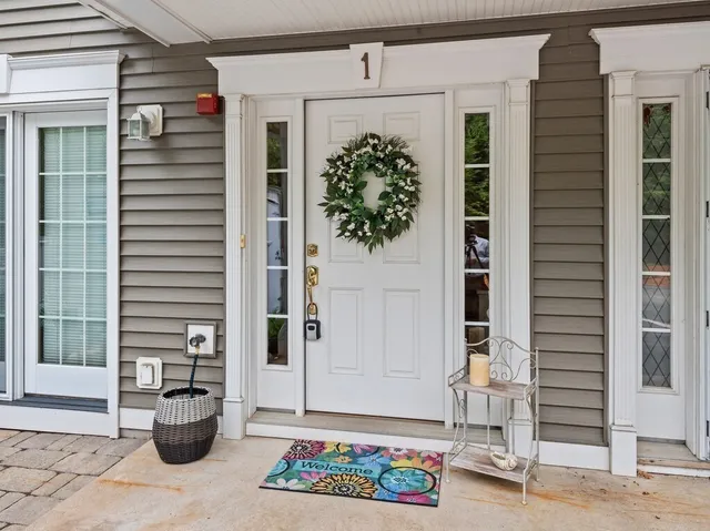 a view of street with houses and car parked on the road