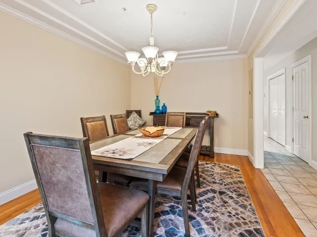 a view of a dining room that has a table and chairs