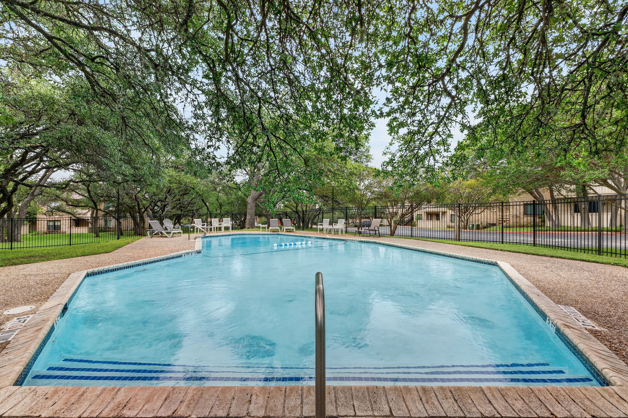 8210 Bent Tree Road, Unit 256 Austin, TX 78759 - Photo 26 of 29 a view of a swimming pool with a yard