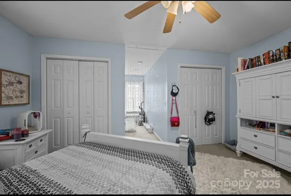 a bedroom with a bed and a cabinets