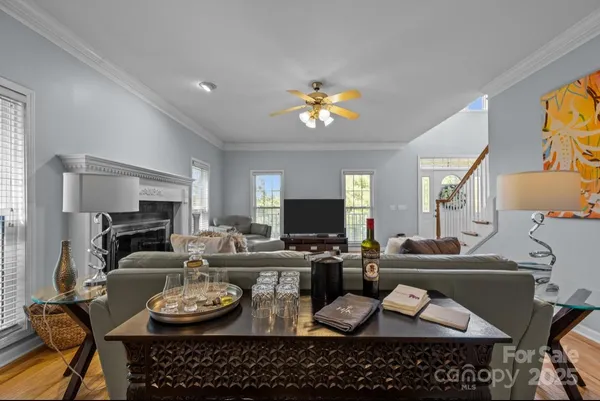 a view of a dining room with furniture and a flat screen tv