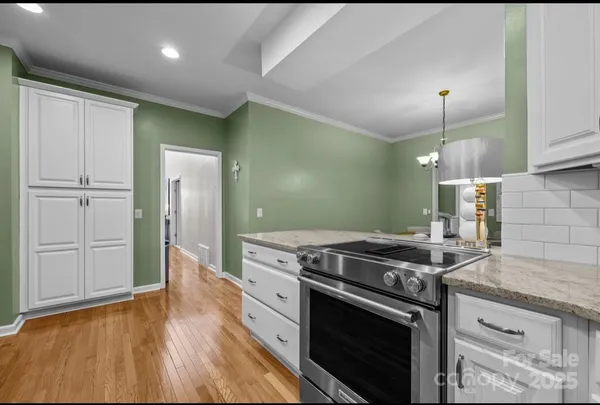 a kitchen that has a sink and a stove