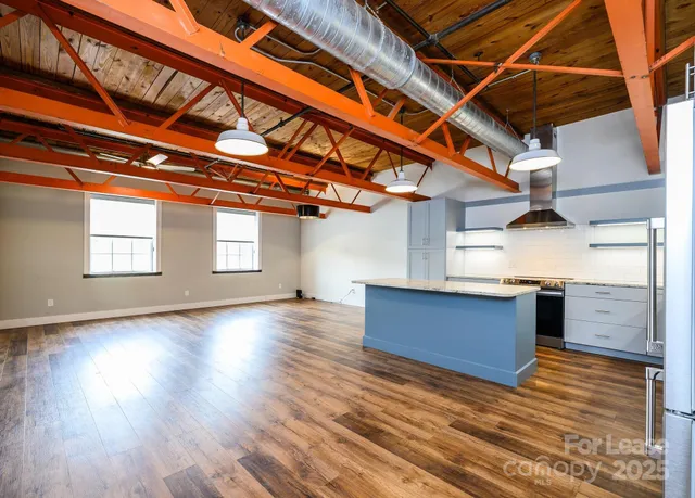 a view of kitchen with cabinets and wooden floor