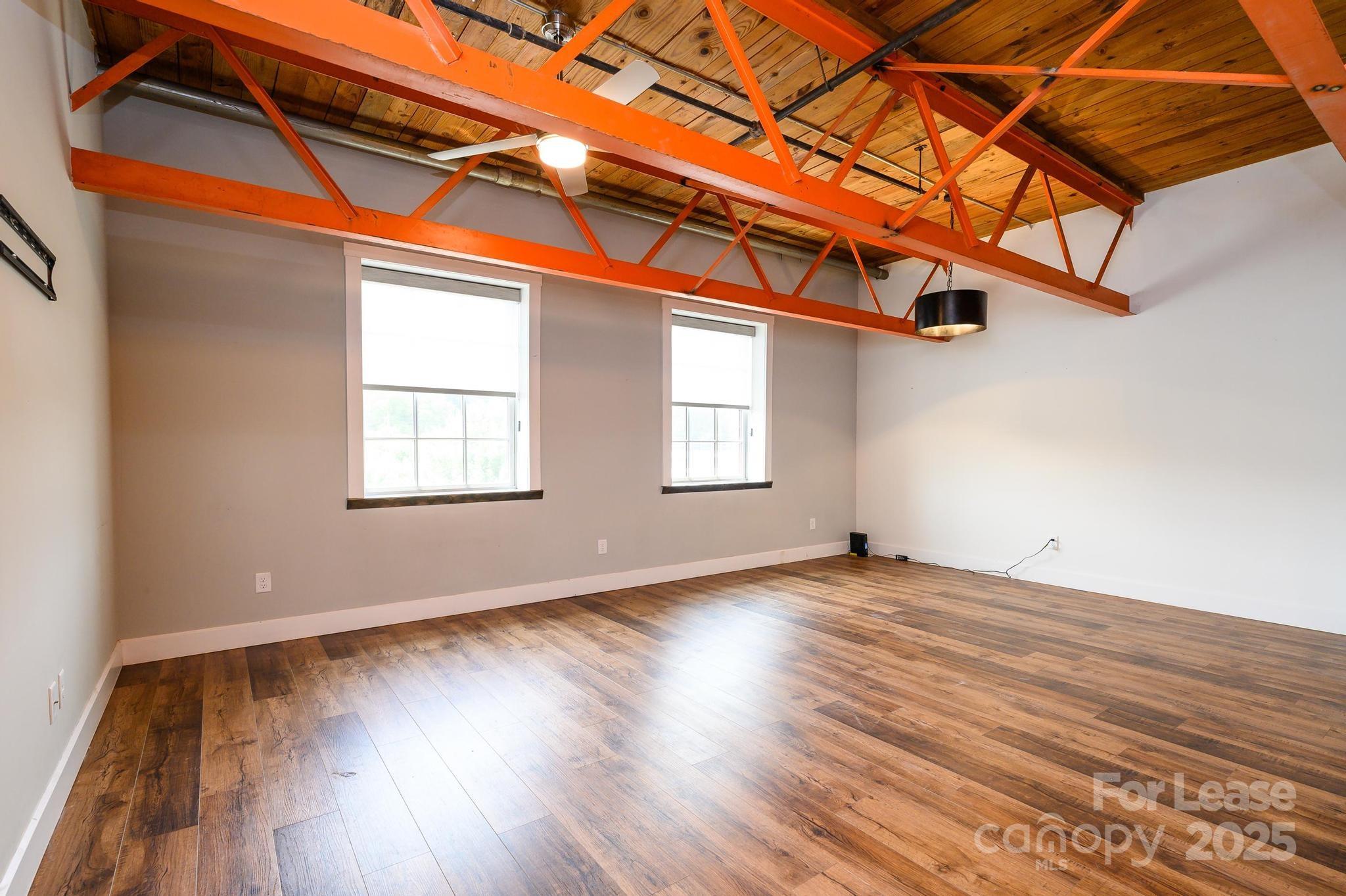 1001 West Avenue Northwest, Unit 1 Lenoir, NC 28645 - Photo 20 of 38 a view of a room with wooden floor and windows