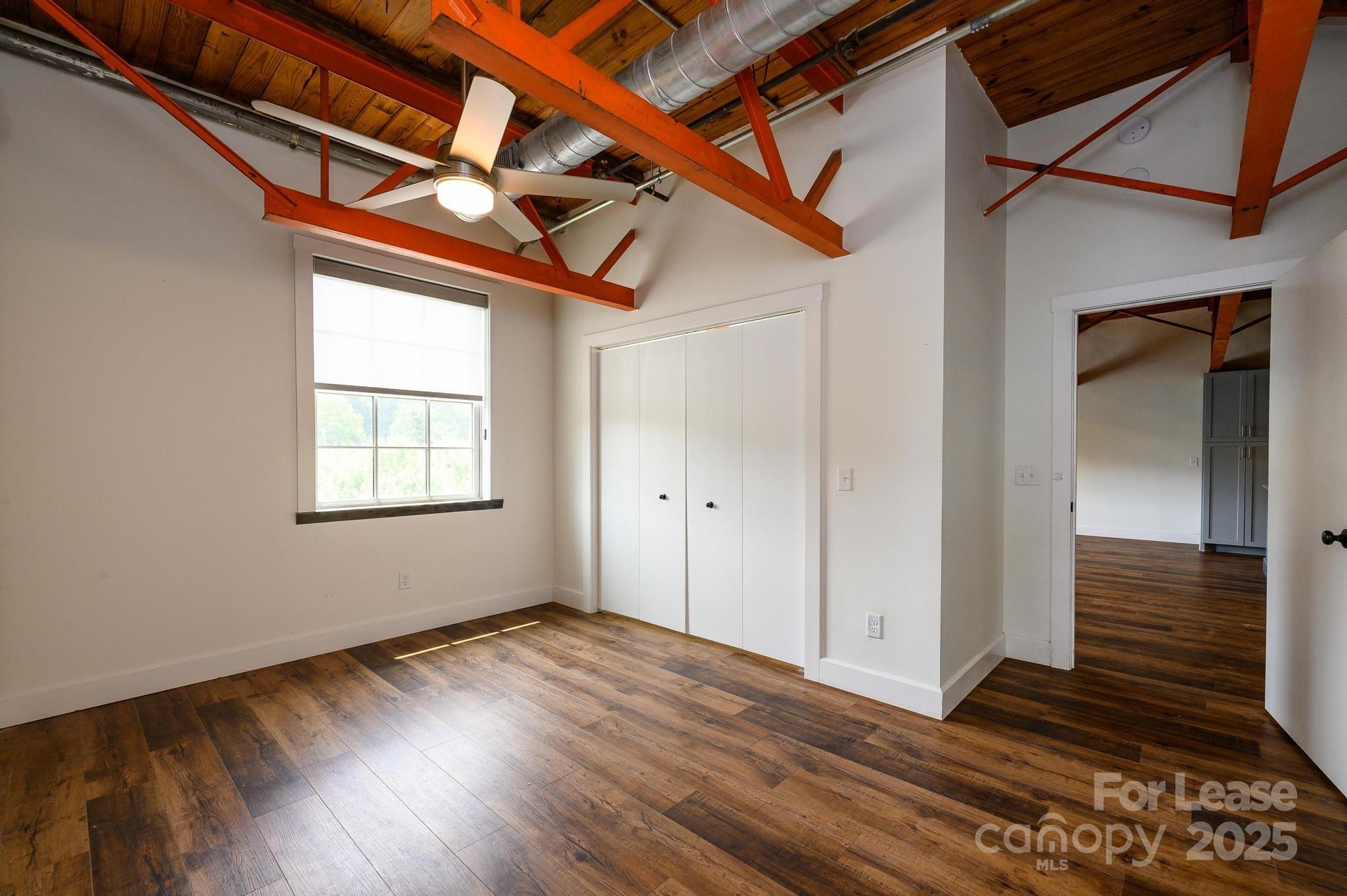 1001 West Avenue Northwest, Unit 1 Lenoir, NC 28645 - Photo 27 of 38 a view of a livingroom with wooden floor and a window