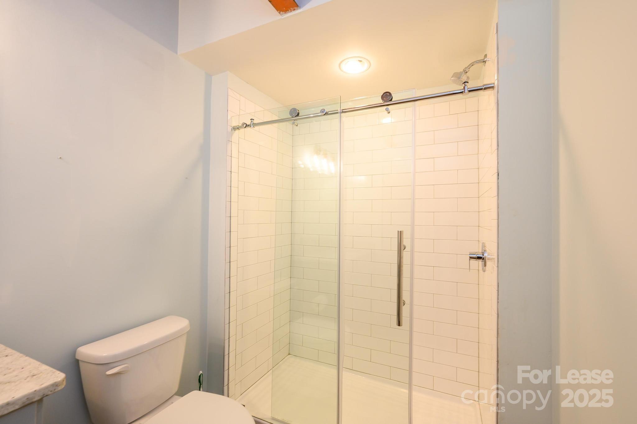 1001 West Avenue Northwest, Unit 1 Lenoir, NC 28645 - Photo 38 of 38 a bathroom with a shower and a toilet