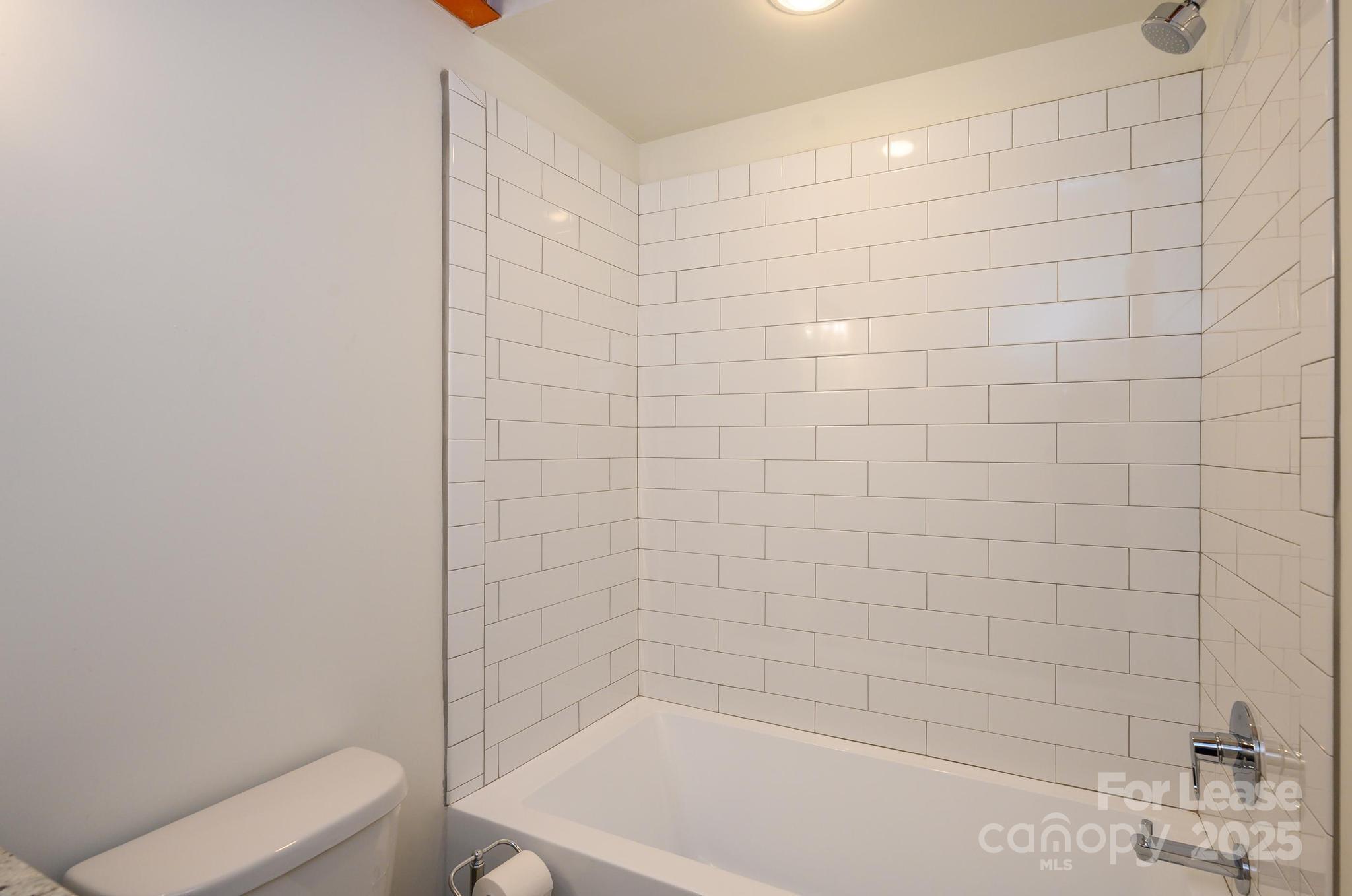 1001 West Avenue Northwest, Unit 1 Lenoir, NC 28645 - Photo 7 of 38 a bathroom with a shower and a toilet