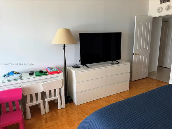 a room with furniture and a flat screen tv
