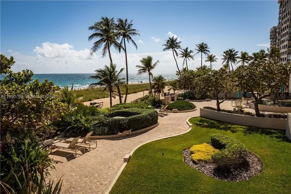 a swimming pool with plants and trees