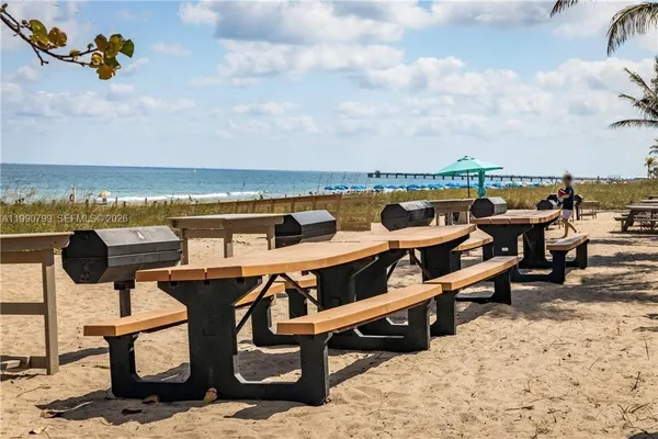 a terrace with outdoor seating and city view
