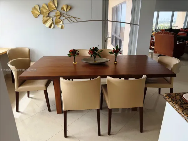 a view of a dining room with furniture and window