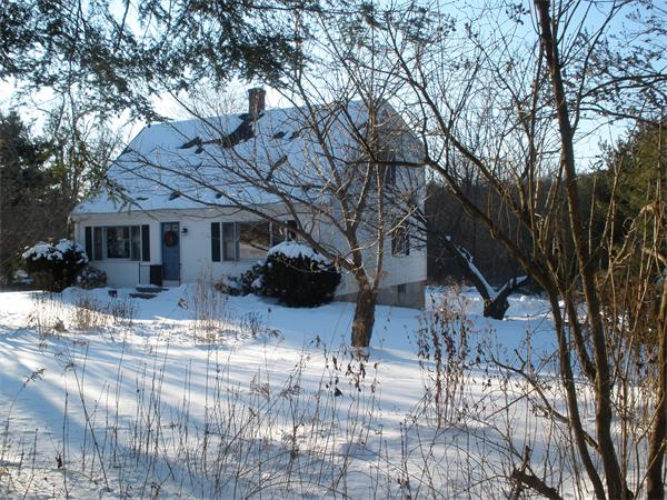 43 Gulf Road Pelham, MA 01002 - Photo 2 of 26 a view of a house with a yard covered with snow