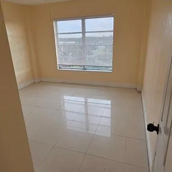 a view of an empty room with a window