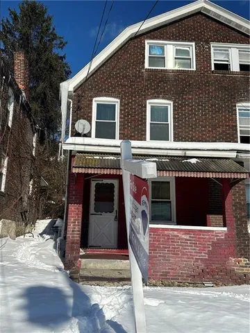 a front view of a house with a garage