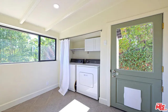 a kitchen with a stove a sink and a refrigerator