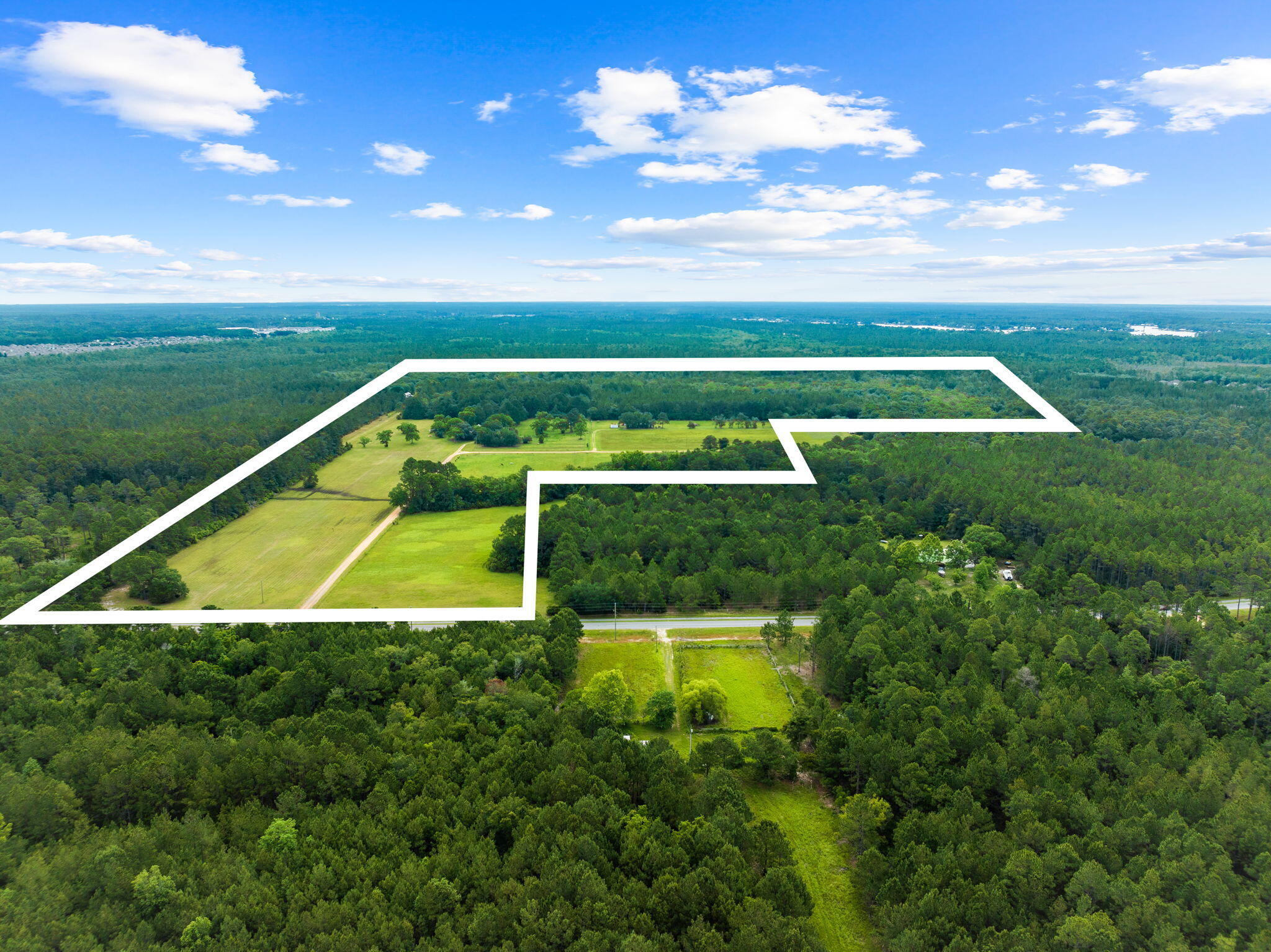 2671 County Highway 83A West Freeport, FL 32439 - Photo 4 of 55 a view of a big yard with swimming pool and green space