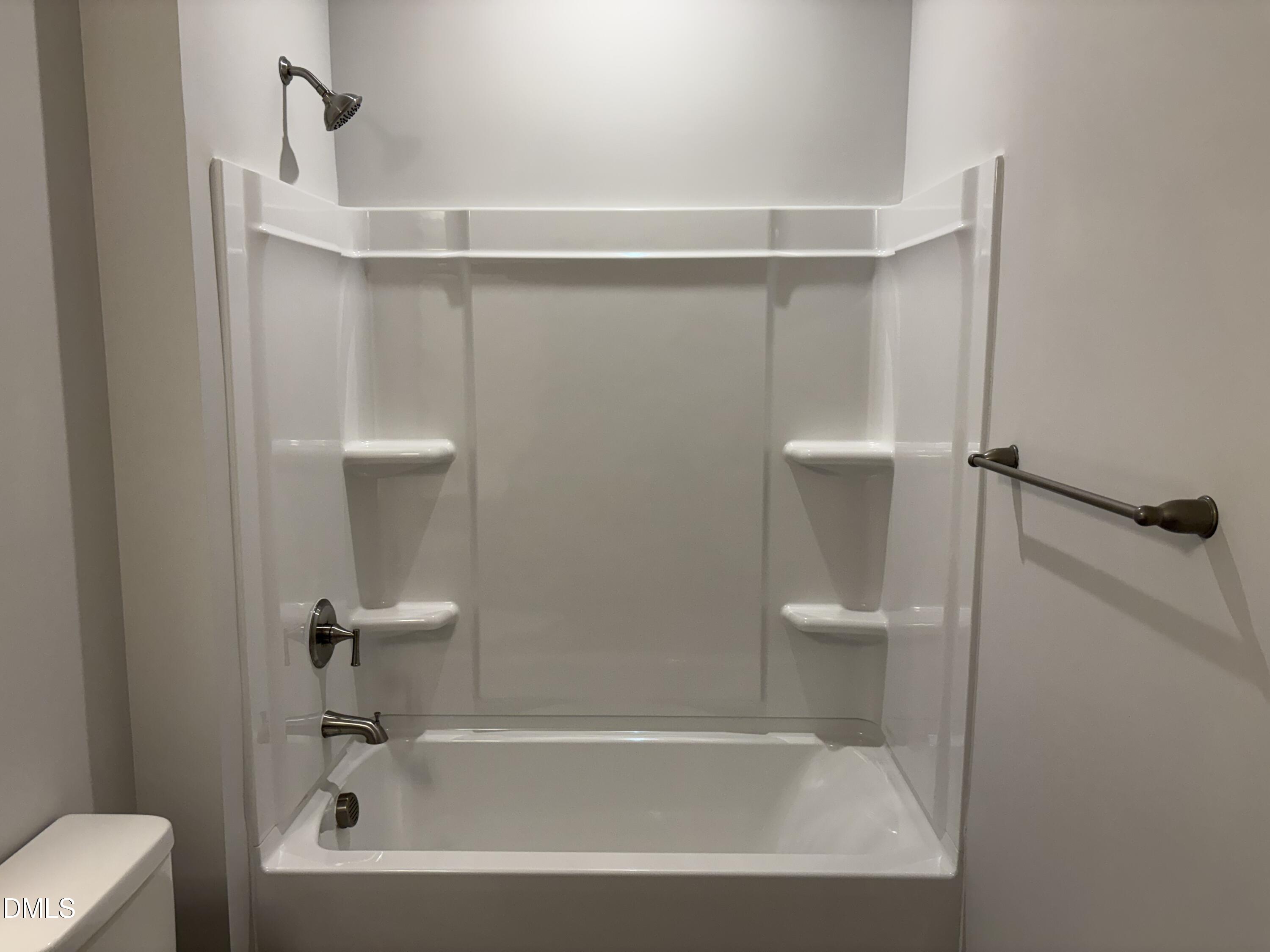 607 Weather Ridge Lane, Unit 24 Cary, NC 27513 - Photo 20 of 26 a bathroom with a bathtub